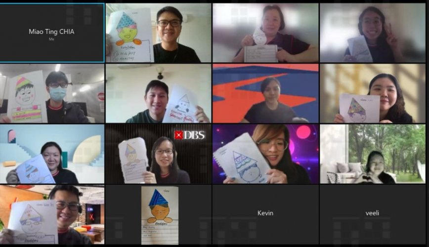 a group of people taking a picture together with their drawings in a zoom call